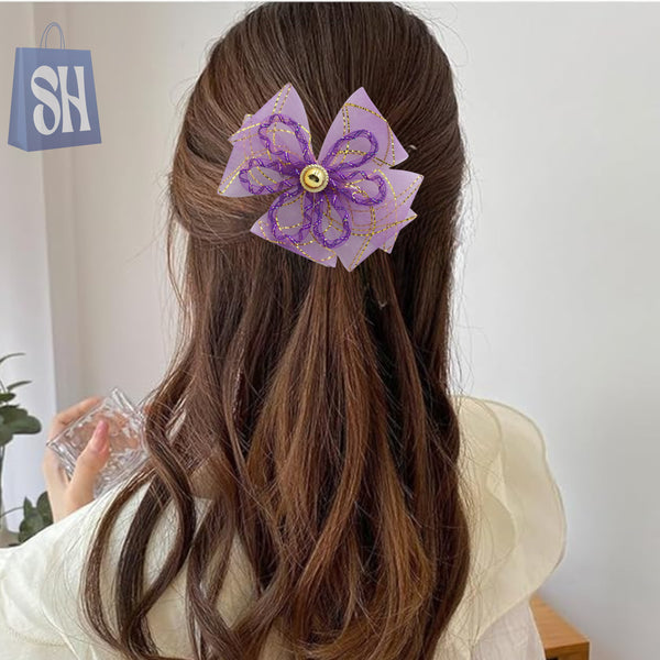 مشبك شعر لامع بزهرة أرجوانية